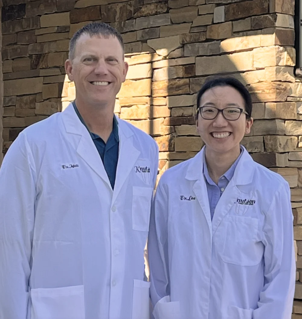 Dr. Matthew Knutson and Dr. Katie Lee outside the clinic